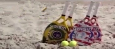 beachtennis racket in sand